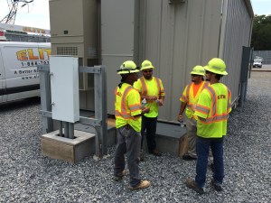 Elite Workers staying hydrated and finding shade while working on hot summer days. Employees from left to right: Joe Hayes, Scotty Blackburn, Travis Ramey, Josh Treveer.