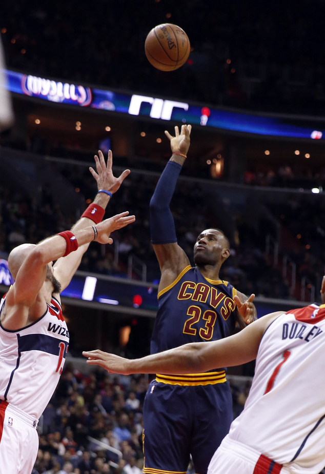 Cleveland Cavaliers forward LeBron James (23) shoots over Washington Wizards center Marcin Gortat, left, during the first half of an NBA basketball game Wedn...