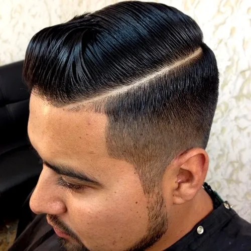 men's side part hairstyle with fade on the sides