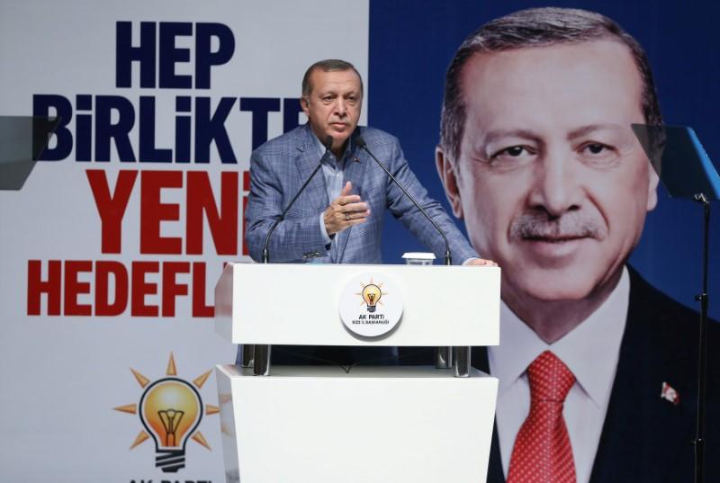 Turkish President Tayyip Erdogan speaks during a meeting of his ruling AK Party in Rize, Turkey. The party banner in the background reads that: "Together with new targets".