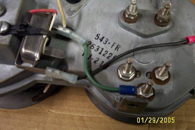 The back housing or the printed circuit board. Source Guide
