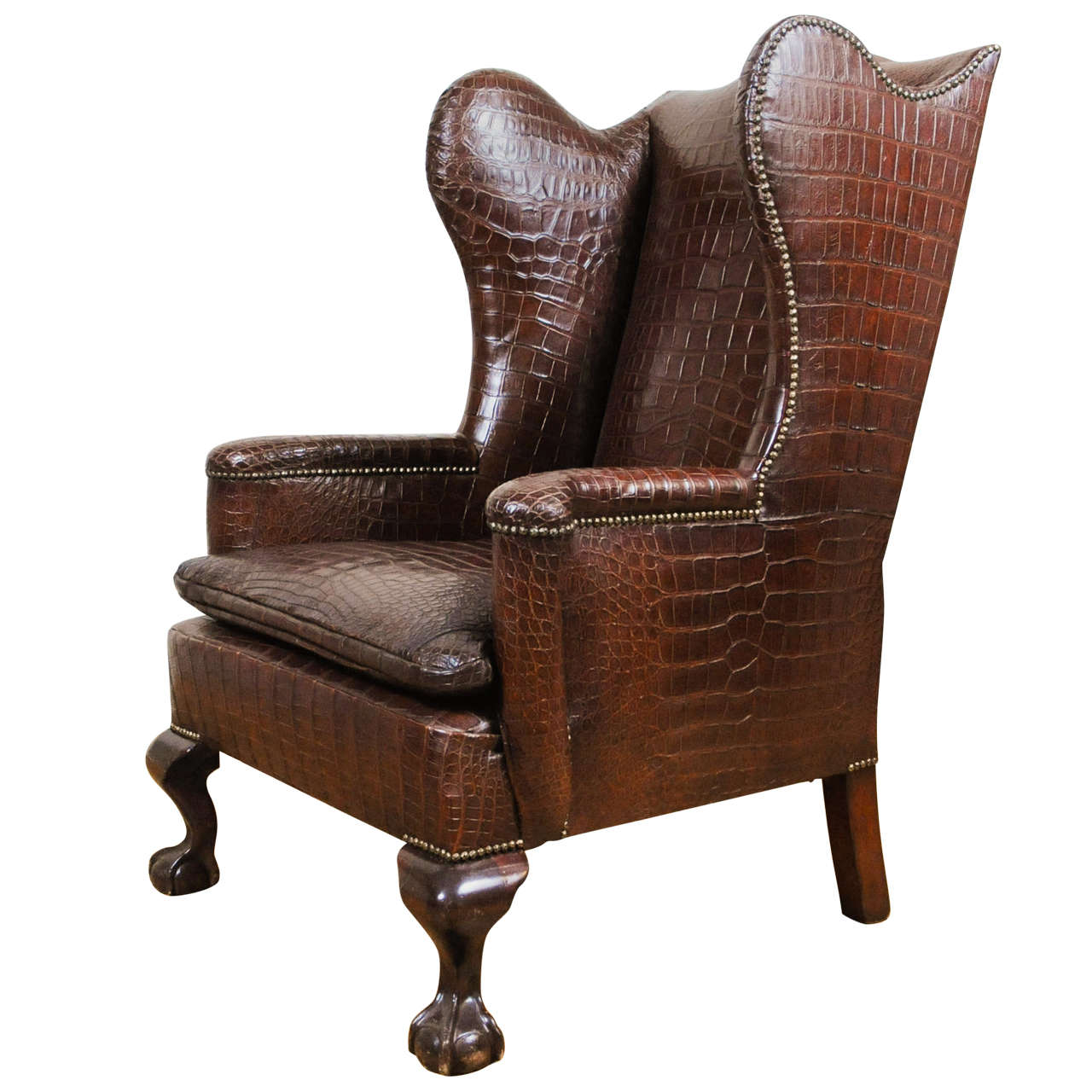 The chairs have beautiful, sculptural front legs. A Very Unusual And Chic Crocodile Upholstered Wing Chair