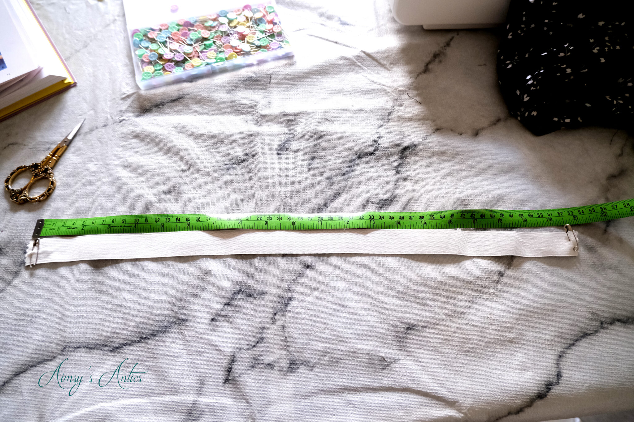 Elastic piece cut out with saftey pins in either end