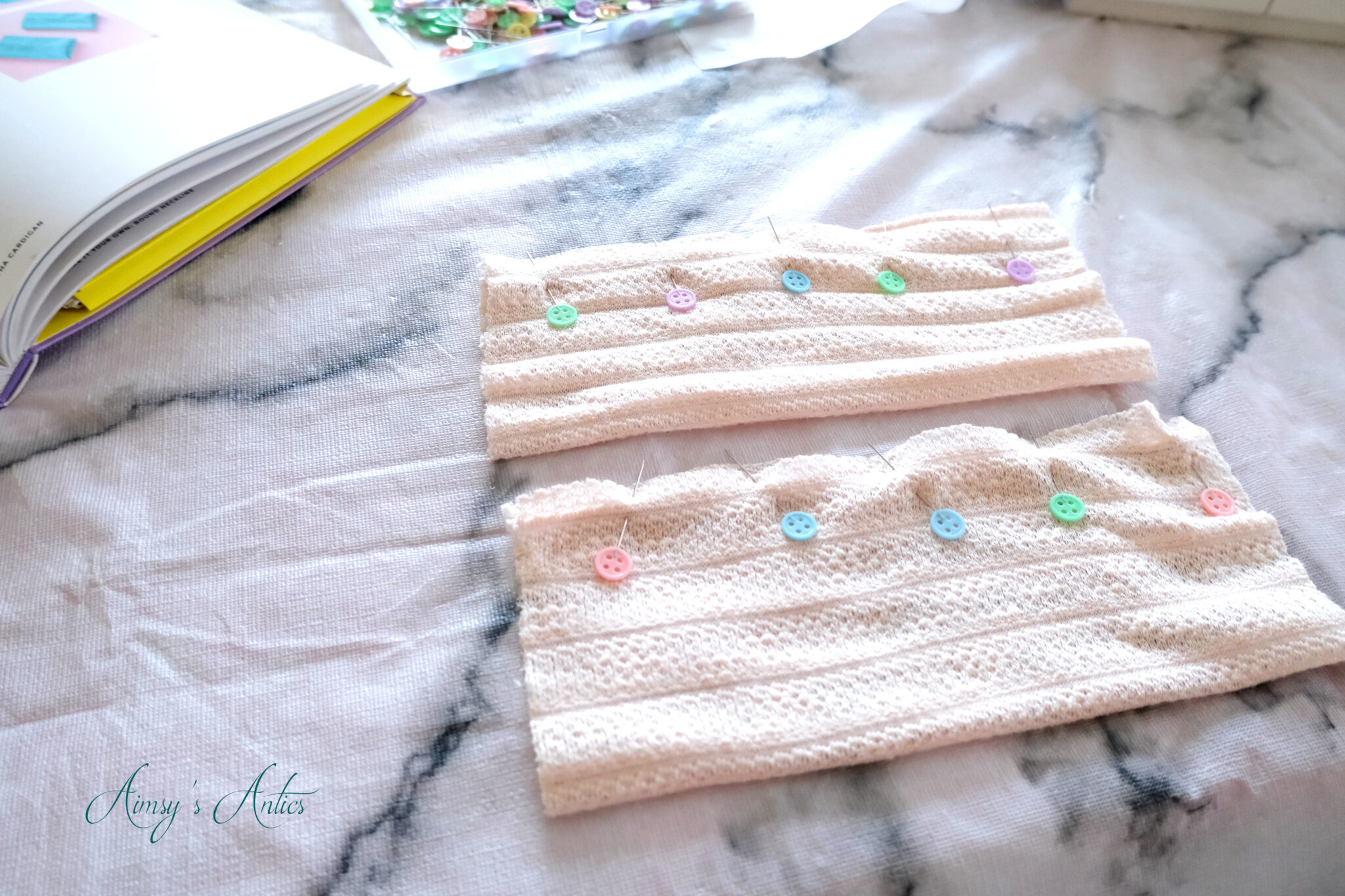 Cuffs pinned long edges together for sewing