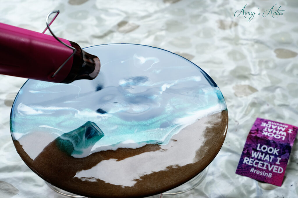 Creating waves in the resin with a heat gun