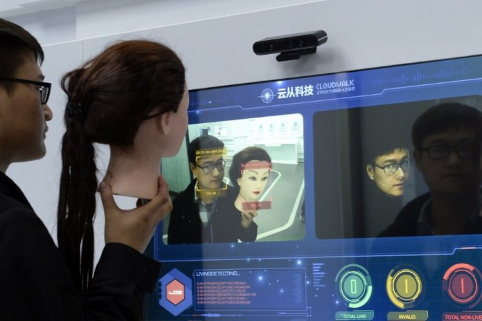 A man demonstrates the AI powered facial recognition technology by Cloudwalk. Photo SCMP Handout
