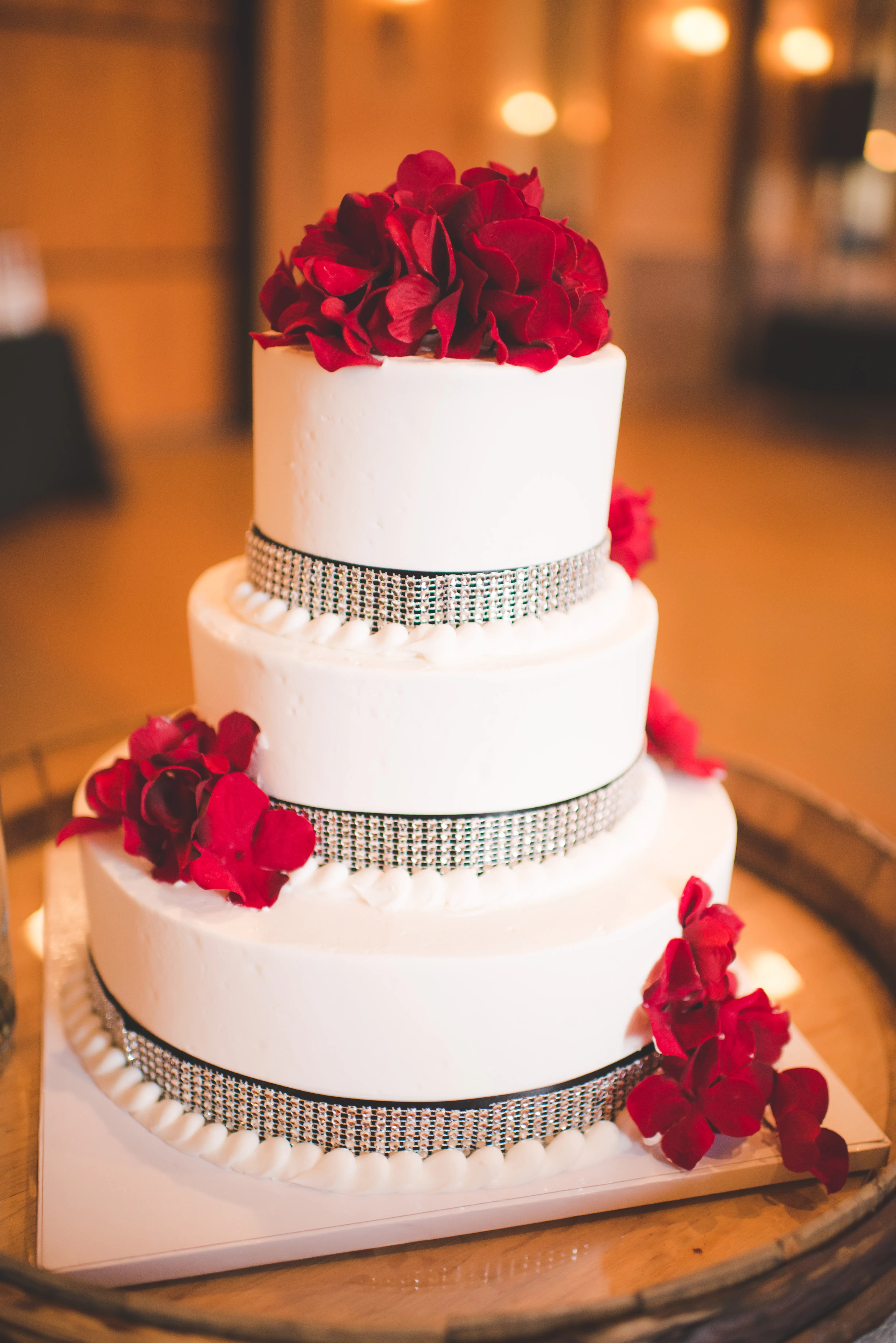 3 tier red and ivory heart wedding cake with open rose and beaded board. Three Tier Crystal Decorated White Cake