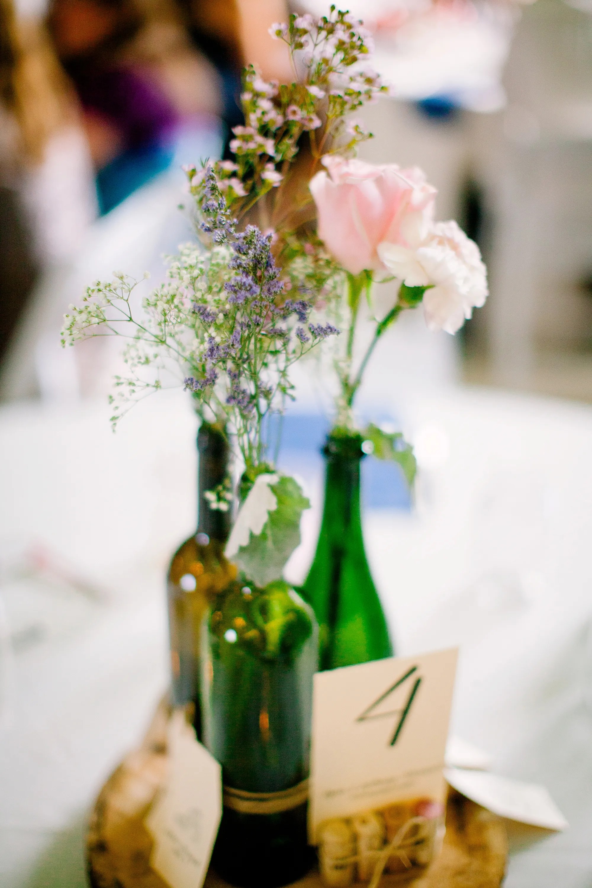 From silk dresses to ditching the bouquet and garter tosses, here are the latest ceremony and reception fads, according to a wedding planner. Wine Bottle Wedding Centerpieces