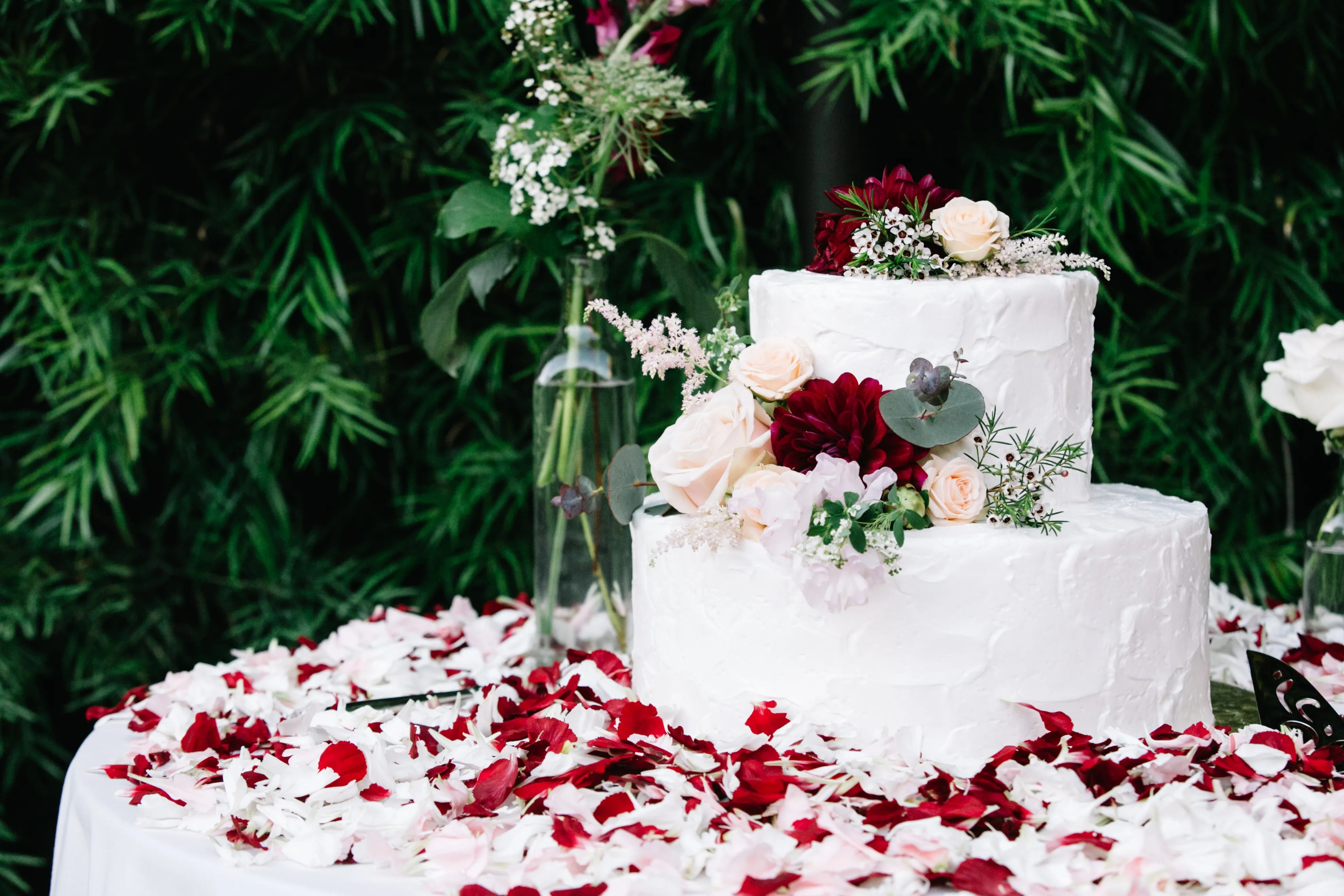 Wedding flowers with greenery view series wedding flowers with greenery. Two-Tier White Wedding Cake With Flowers and Greenery