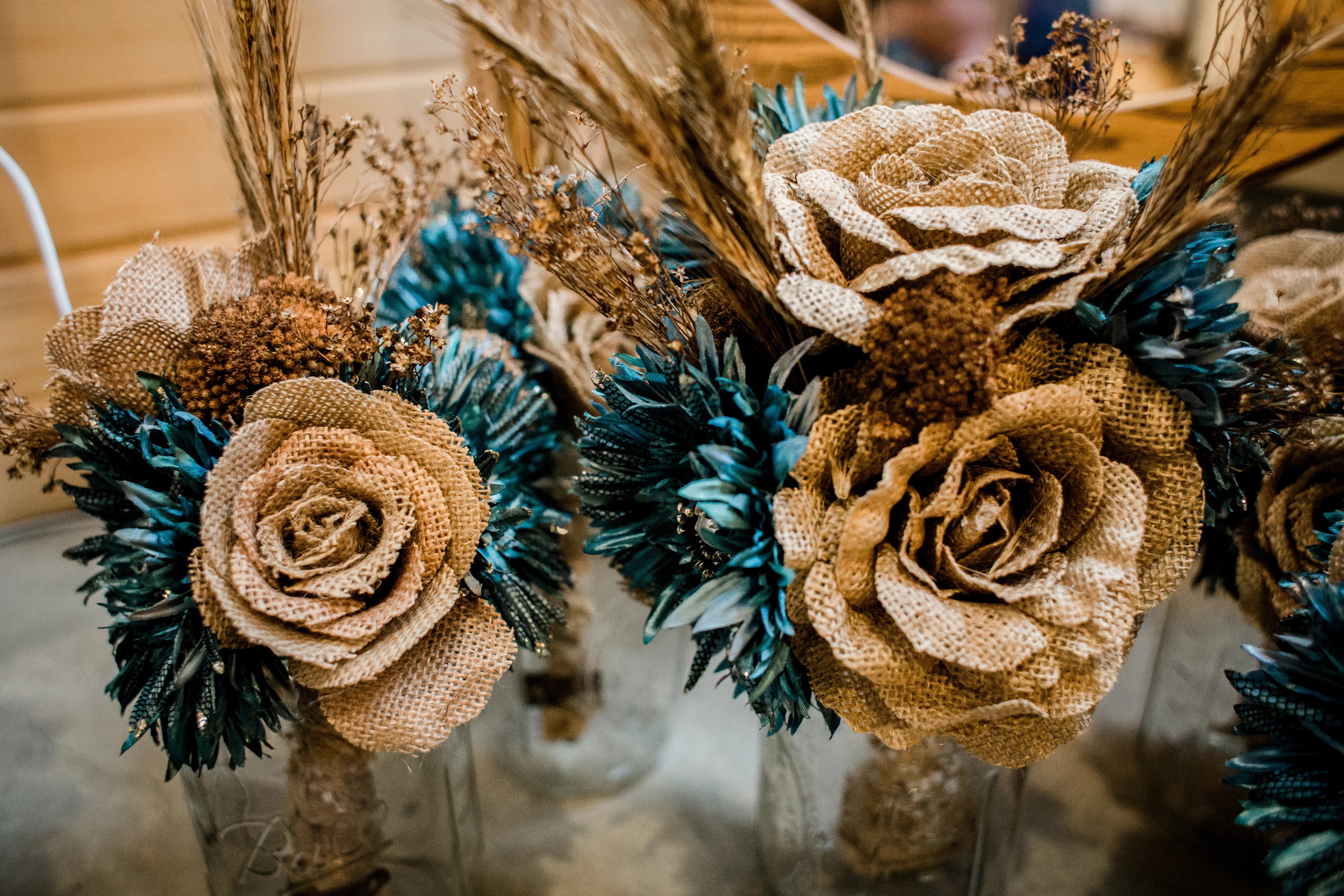 These bright and breezy embroidered wedding dresses bring the wow factor. DIY Brown and Teal Floral Arrangements