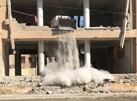 brown building collapsing