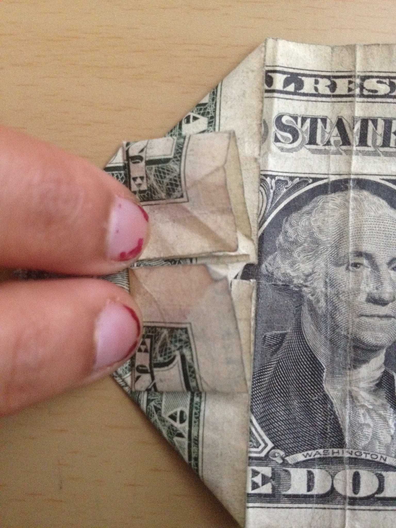 Get a crisp dollar bill. How To Make An Origami Dollar Heart That Holds A Quarter B C Guides