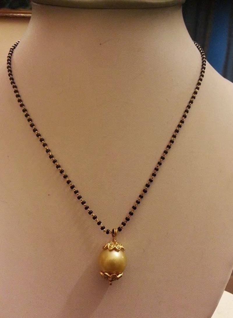 Check out the traditional, unique and latest gold mangalsutra designs and price. White pearl mangalsutra - ANMOL JEWELS&PEARLS - 1614144