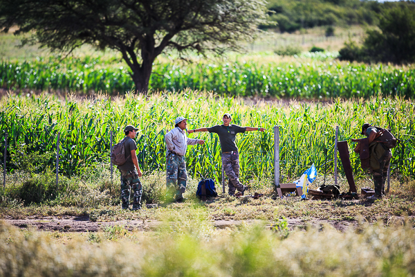 The field assistants relax before the clear up at the end of the day.