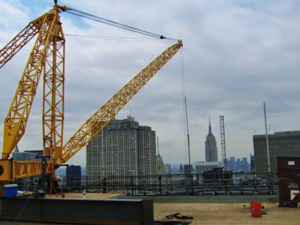 The Master Riggers at BUDCO installed a derrick on the roof of this high rise building. It was then used for the installation of a cooling tower and pipe risers.