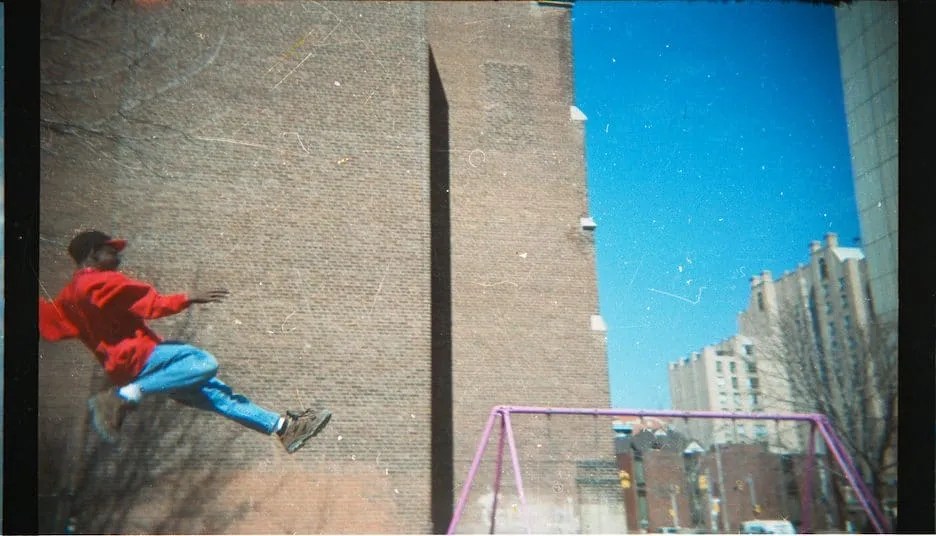 Casey Palmer jumping off of the swings, 1997