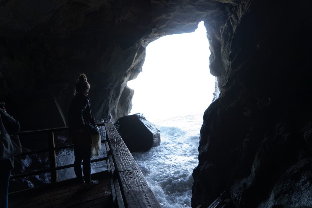 standing in the sunny jim sea cave