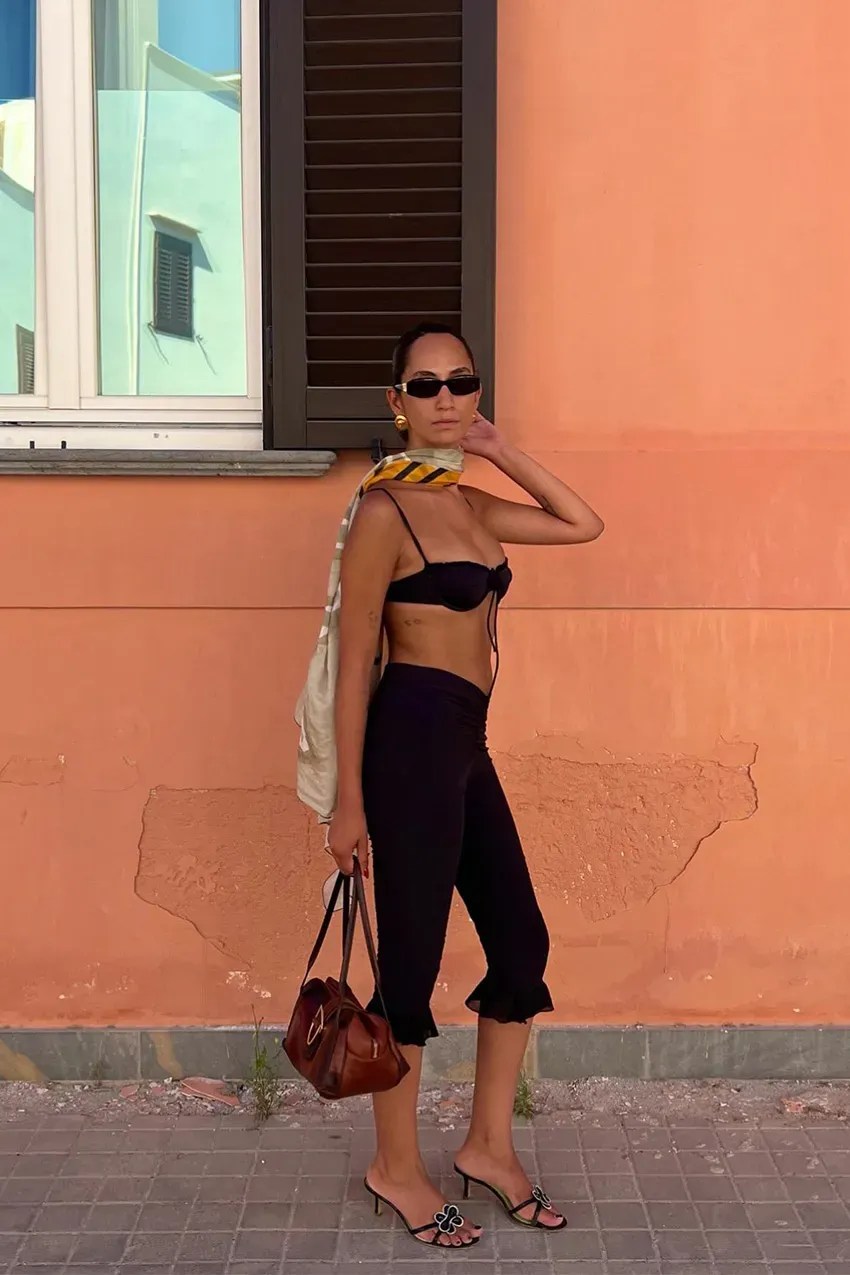 woman wears capri pants