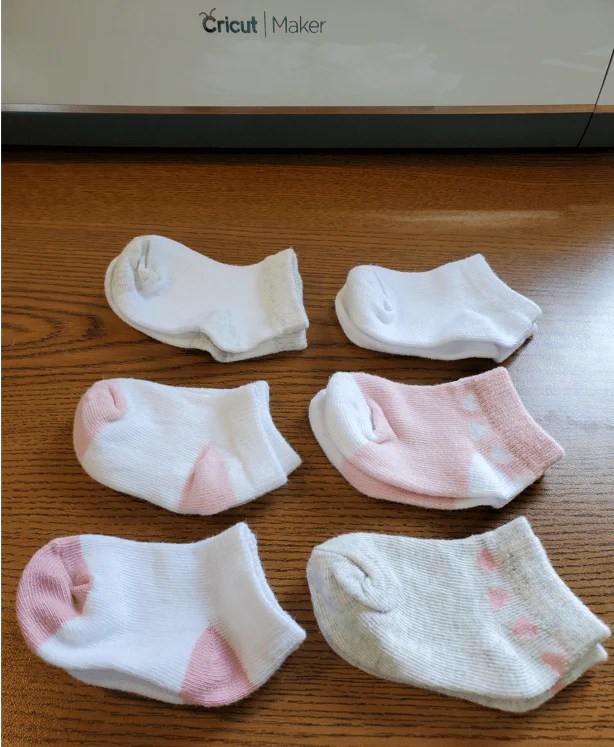 cricut beginner project iron on vinyl on baby socks