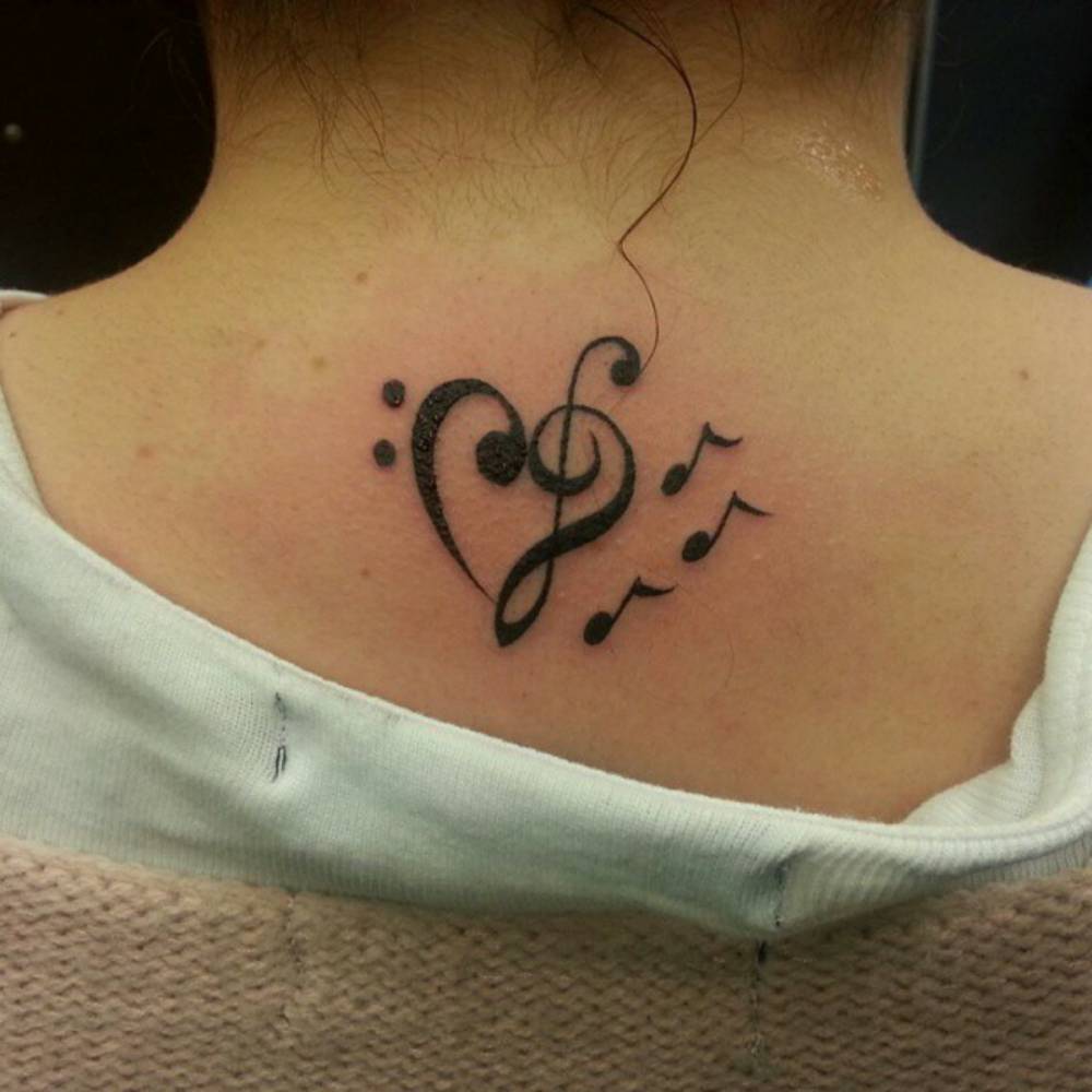 Upper Back Tattoo Of A Bass And A Treble Clef Creating 1000_x_1000_jpg