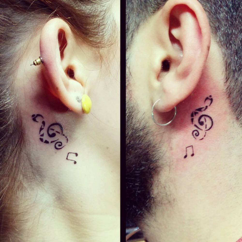 Small Behind The Ear Matching Tattoo Of A Treble Clef 1000_x_1000_jpg