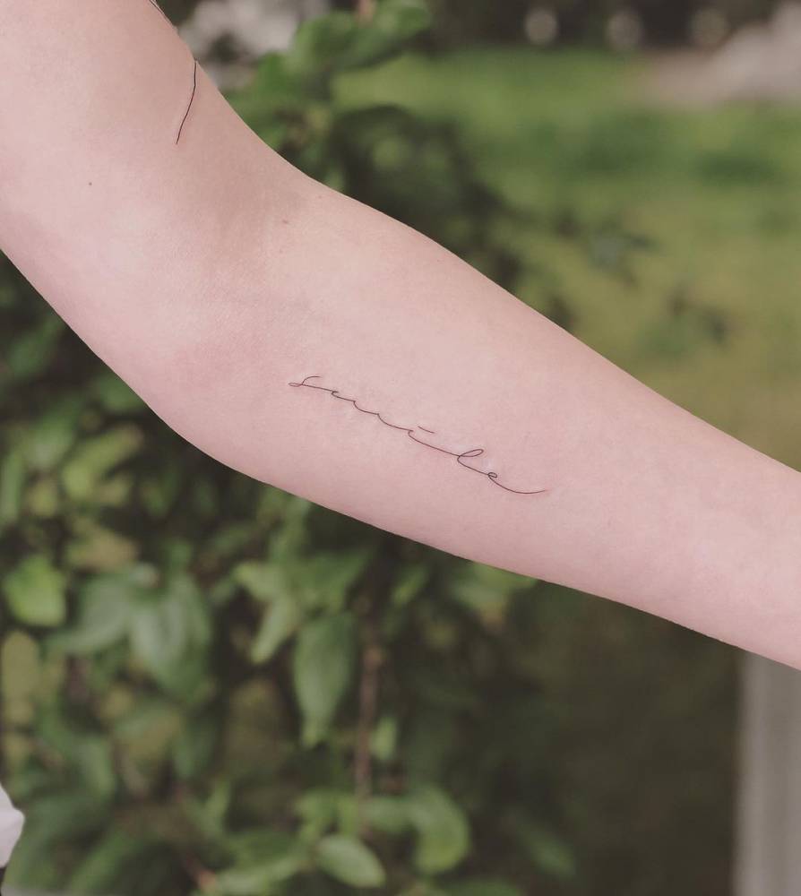 Smile" Lettering Tattoo On The Inner Forearm 1000_x_894_jpg