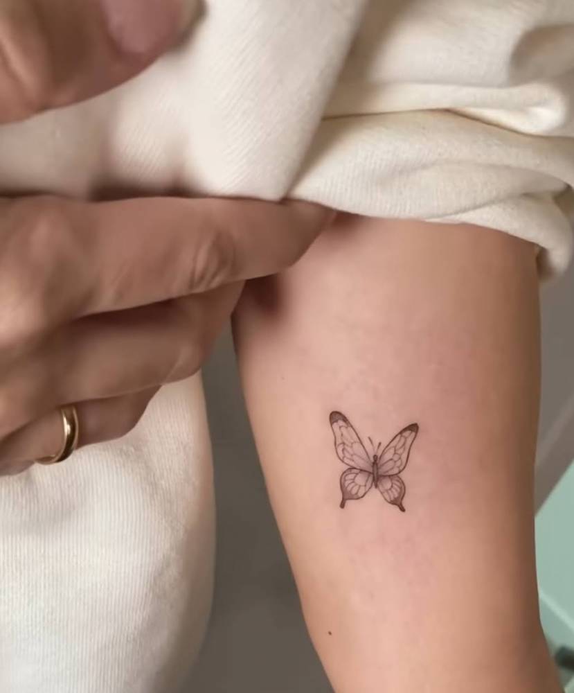 Fine Line Butterfly Tattoo On Laura Escanes' Inner Arm. 1000_x_829_jpg