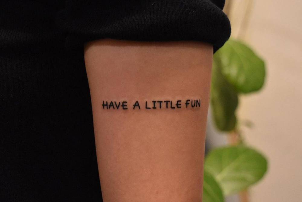 Have A Little Fun" Lettering Tattoo On The Upper Arm. 668_x_1000_jpg