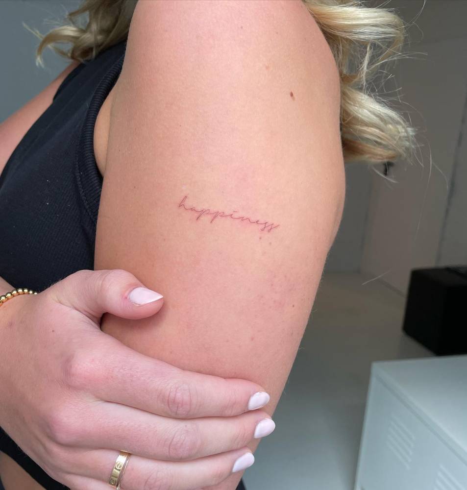 Lettering Tattoo That Says "Happiness" Located On The 1000_x_953_jpg