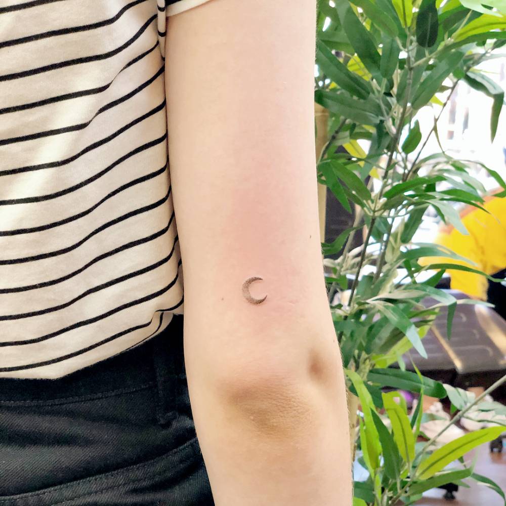 Tiny Crescent Moon Tattoo On The Back Of The Right Arm. 1000_x_1000_jpg