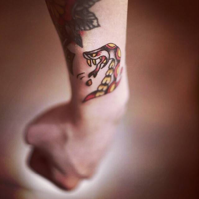Traditional Style Snake Tattoo On The Left Wrist. 640_x_640_jpg