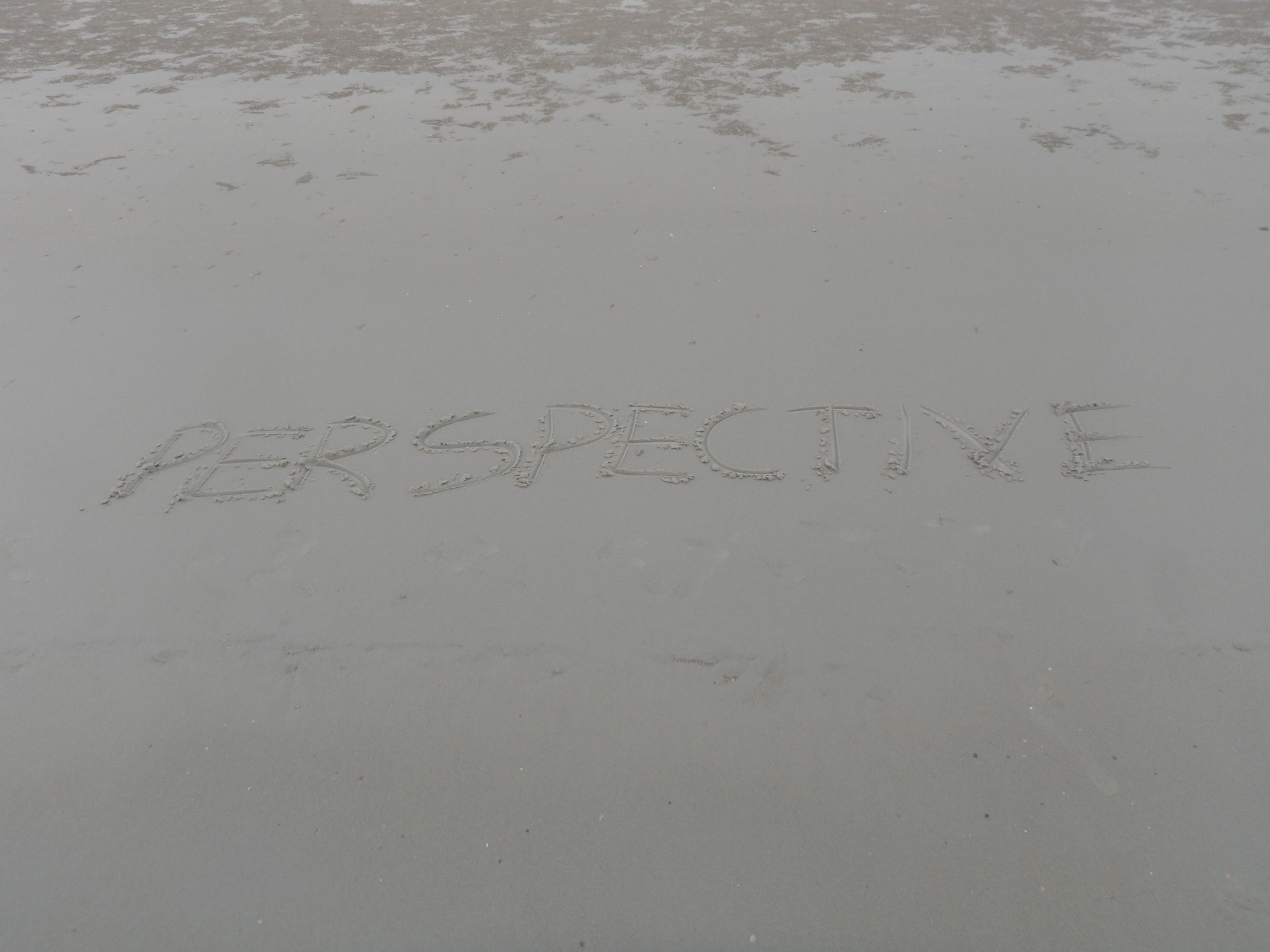 perspective written in sand
