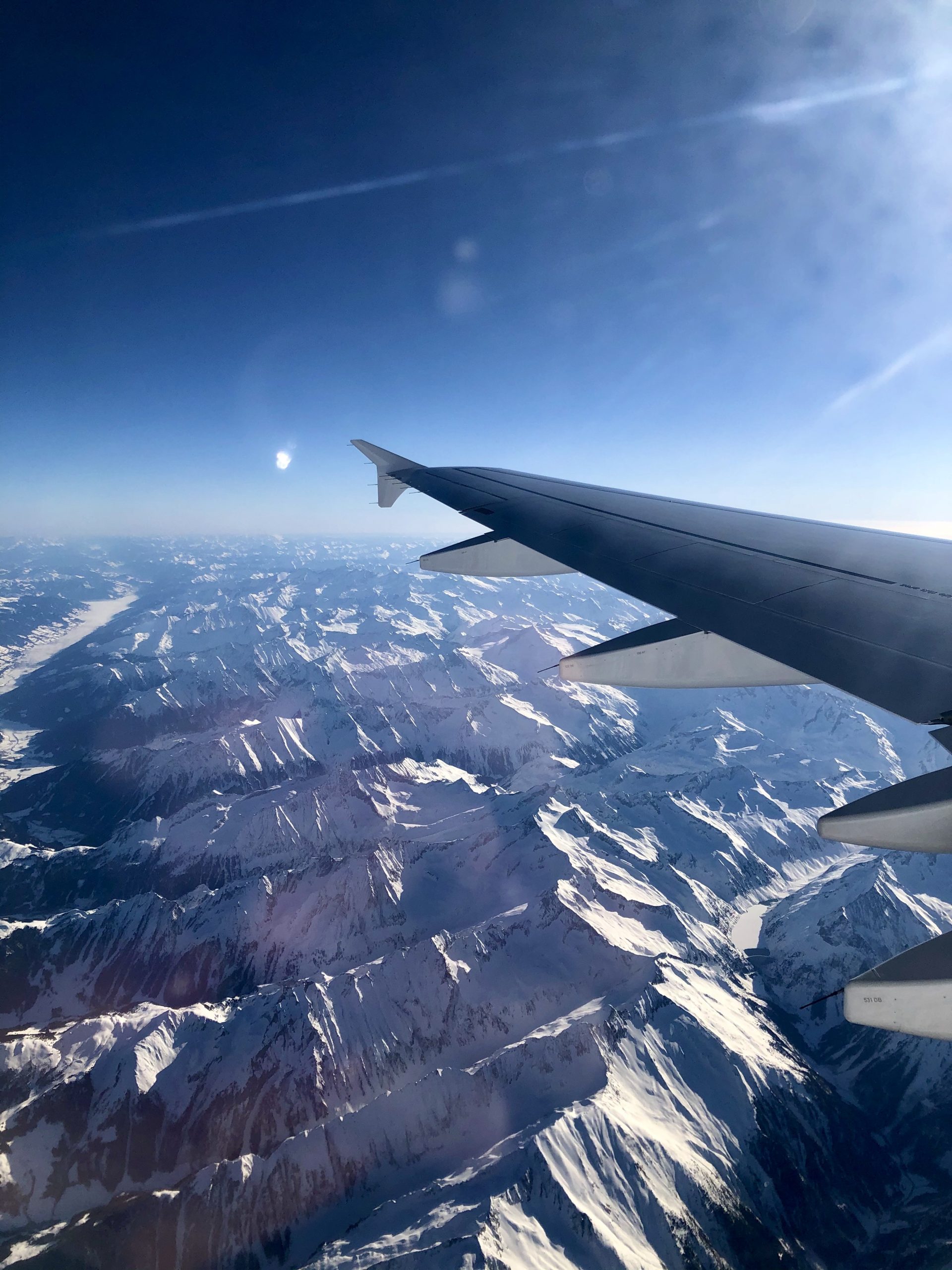 Half awake somewhere over the Austrian Alps en route to Sicily.