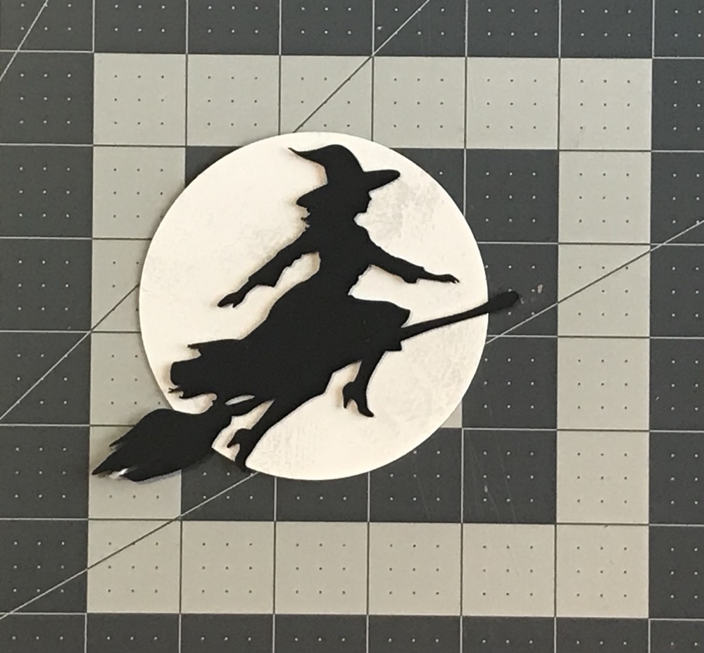 Photo of the witch and broom SVG used in today's How to Make an Exploding Busted Canvas project.