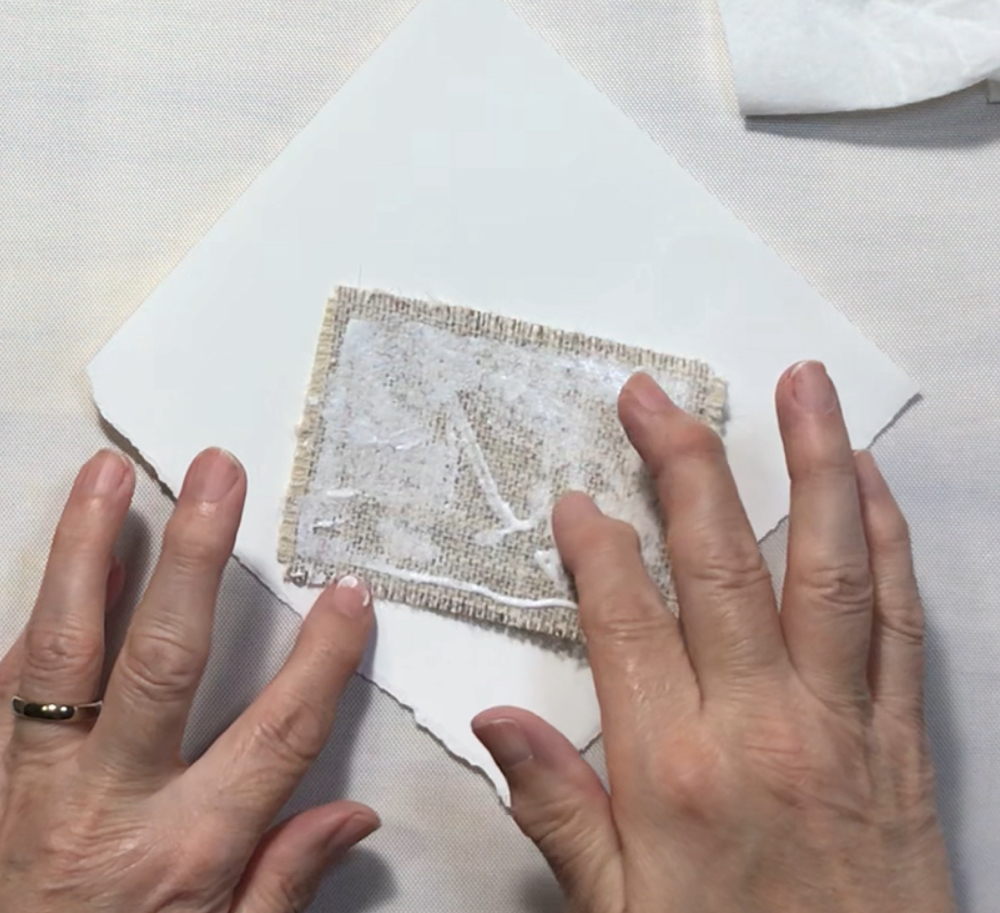 Screen shot showing how easy it is to spread the Liquid Stitch fabric adhesive to the back of the patch for today's How to Sublimate Hat Patches post.