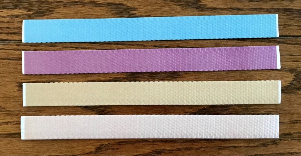 Photo of the corresponding keychains showing the backs.
