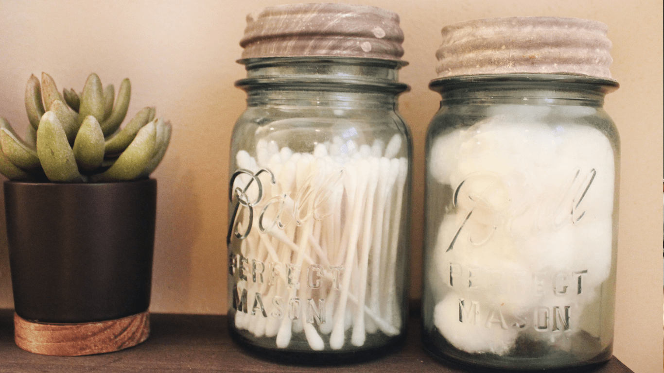 Containers for bathroom organization. Tips from Data Driven Real Estate