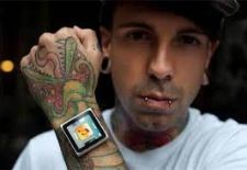 iDermal: Body piercer implants arm w/studs to magnetically attach iPod as a watch. Really.