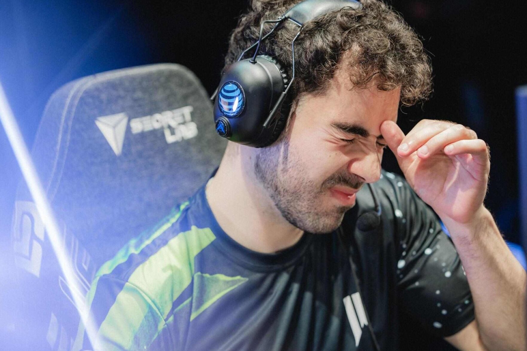 A Shopify Rebellion player sits at his PC with eyes closed after a tough loss, capturing the team’s struggles and mounting pressure in LCS 2026 Lock-In.