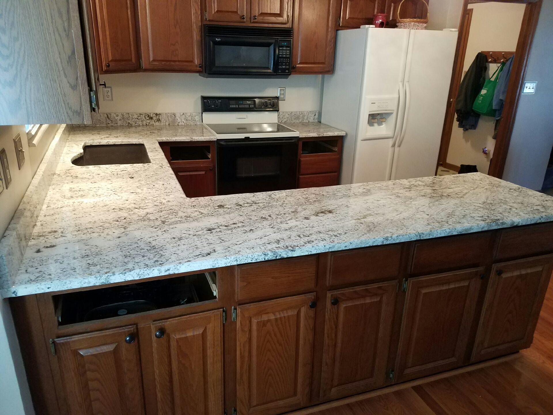 Valle nevado granite countertop features an earthy color scheme, consisting of a light cream base, and a pattern of white, black, gray, and taupe specklings . Granite Kitchen Countertop | Gallery | Granite Slabs | O