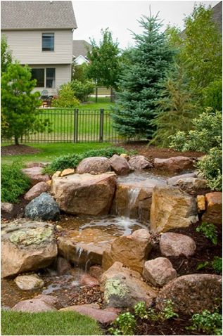 We may earn commission from links on this page, but we only recommend products we back. Backyard Waterfalls and Ponds To Beautify Your Outdoor Decor