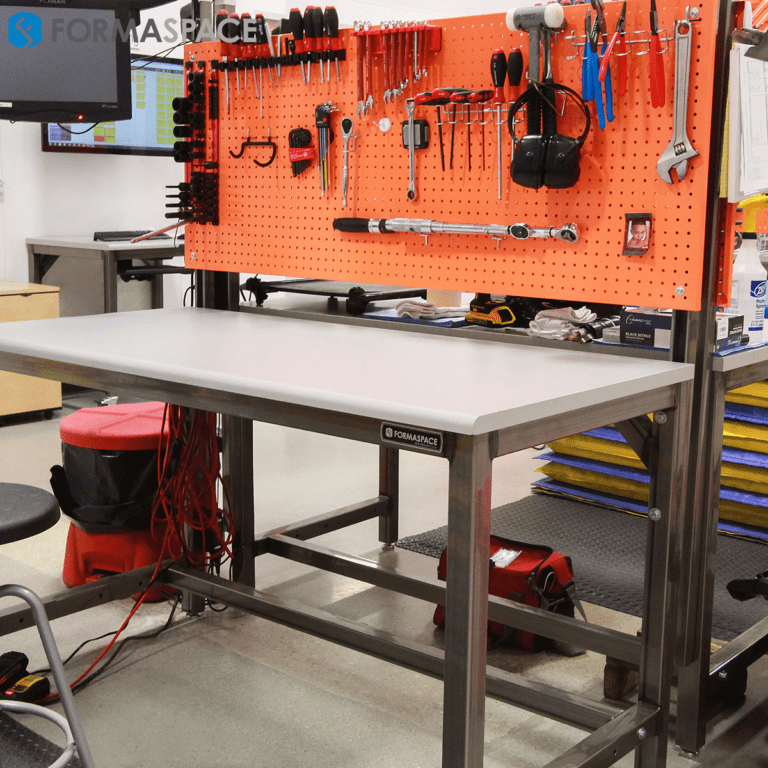 When you think of a garden, you may think of a strictly utilitarian location where vegetables are grown for food. Manufacturing Workbenches with Orange Pegboards | Formaspace