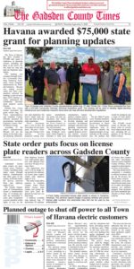 Front page of the September 3, 2026 edition of The Gadsden County Times reporting on Havana being awarded a $75,000 state grant for planning updates, with a group photo of town and county representatives including Senator Corey Simon and Sheriff Morris Young holding an ceremonial check. Lower section headlines cover state orders regarding license plate readers across Gadsden County alongside a close-up image of a Flock Safety camera, and a planned power outage for all Town of Havana electric customers.