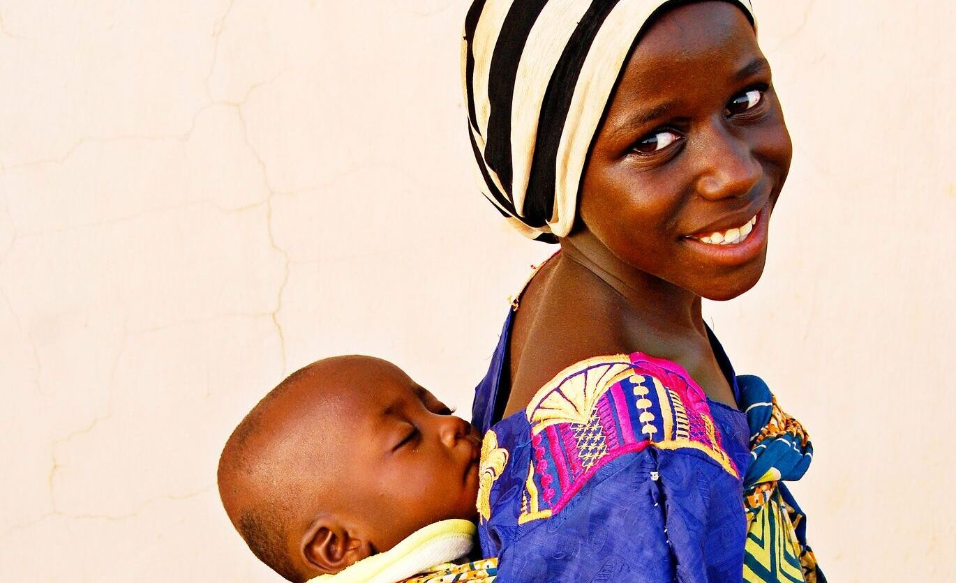 A young mother with a baby