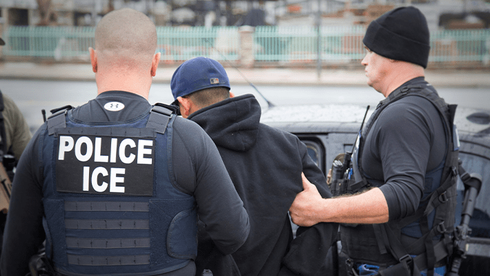 ICE operatives arresting undocumented immigrants
