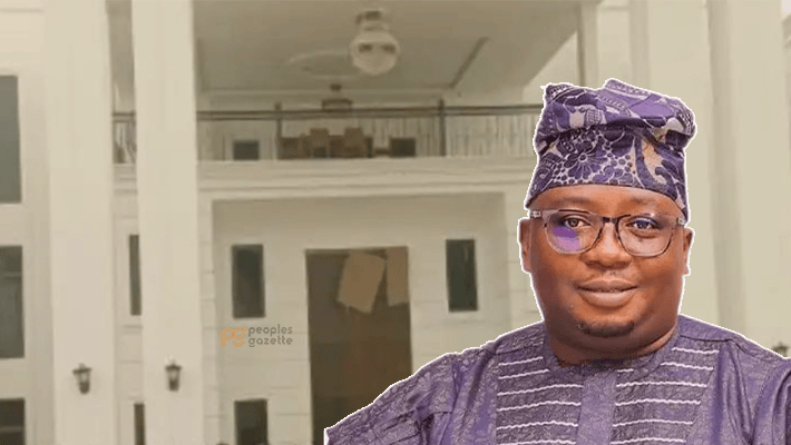 Adebayo Adelabu with his mansion