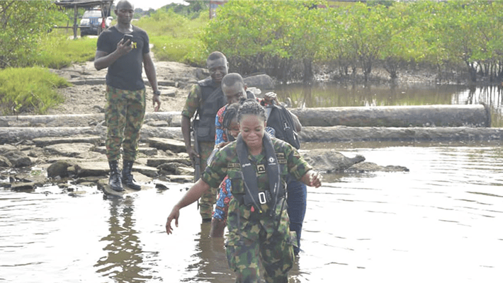 Naval officers in creek during operation