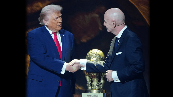 Trump with World Cup standing with FIFA president, Folarin