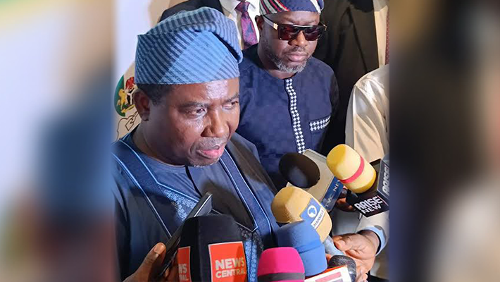 Amupitan speaking to journalists