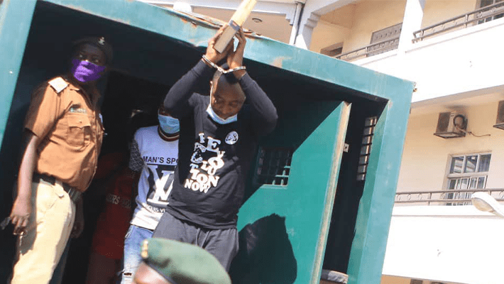 Old photo of Omoyele Sowore in handcuffs